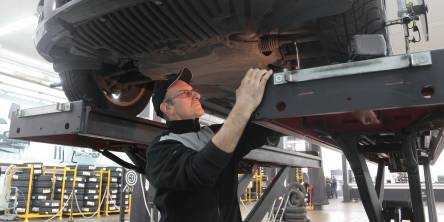 A mechanic checking the car